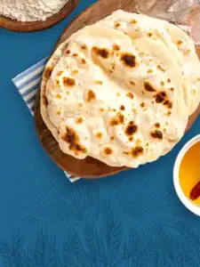 Roti on wooden plate.