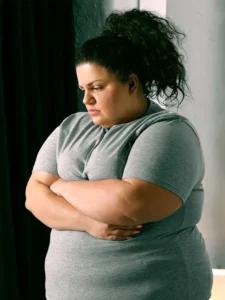 A young obese woman feeling stressed.
