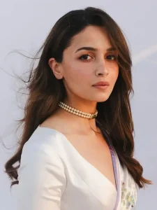 Alia Bhatt wearing a white saree with floral print on it.